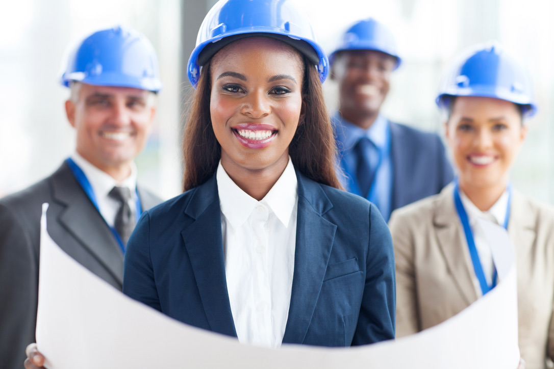 happy african american female architect with team on background